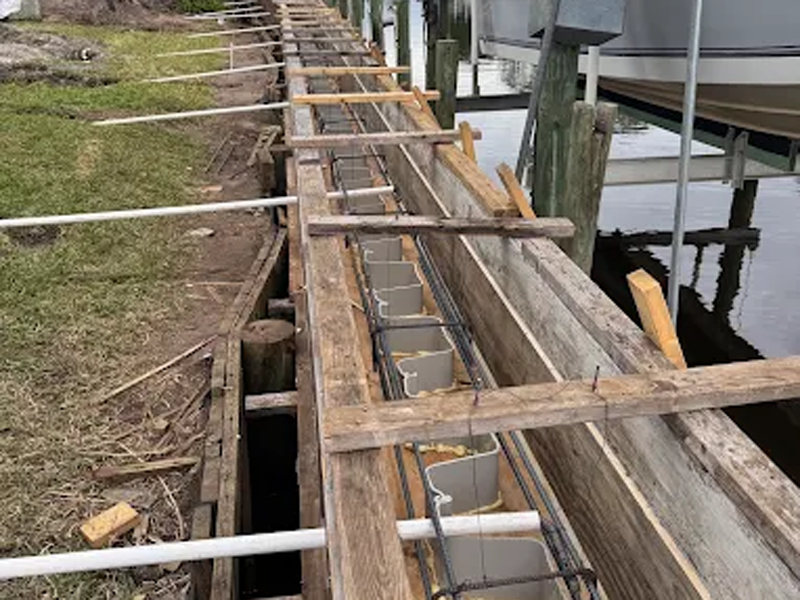 New vinyl seawall with reinforced concrete cap at a Stuart riverfront property